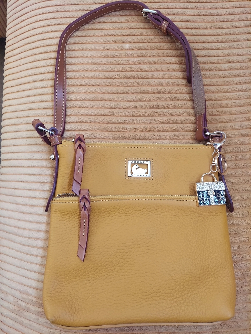 Dooney & Bourke Mustard Yellow Leather Crossbody with Brown Trim and Charm